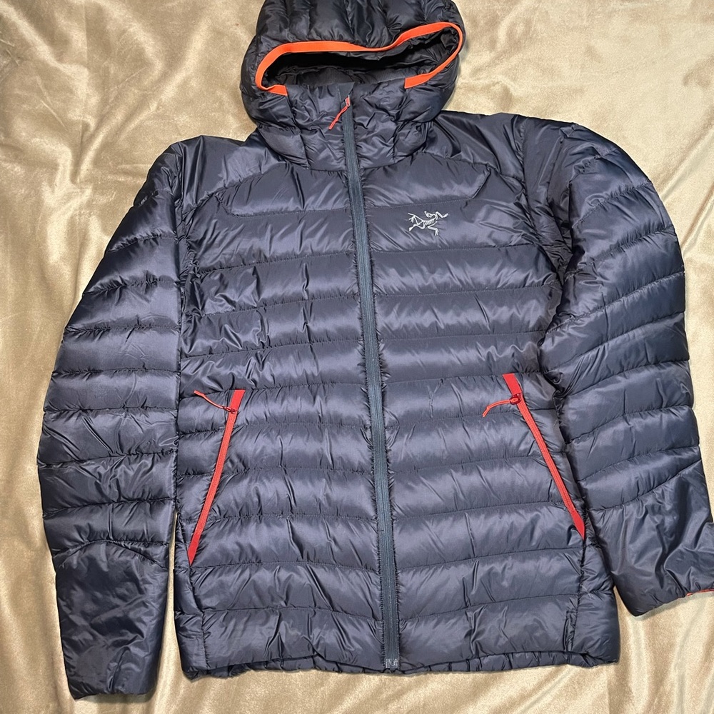 Arc’teryx hooded jacket with red trim